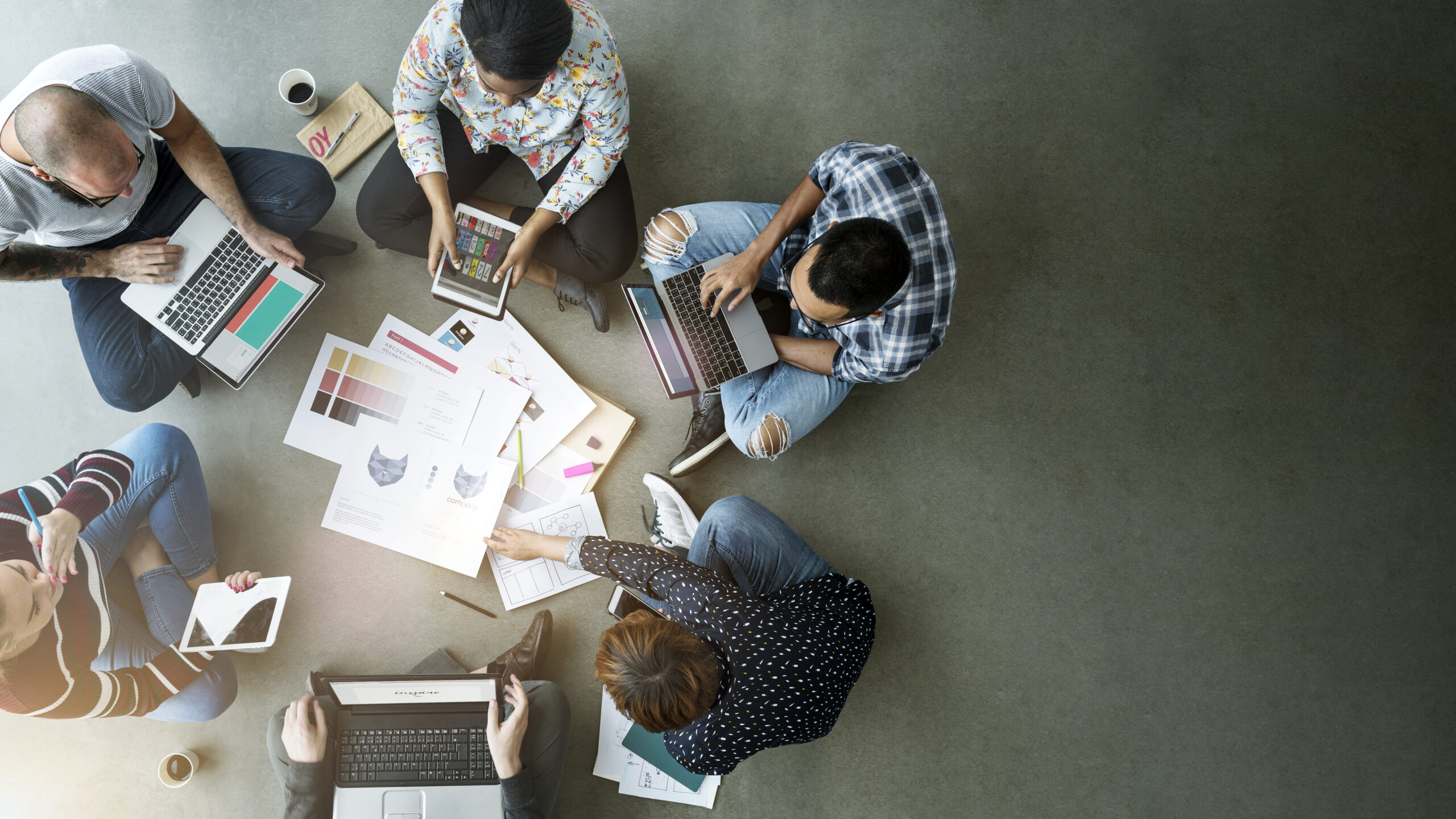 business team sitting floor scaled